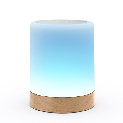 Single LuvLink Friendship Lamp glowing blue with a natural wood base on a white background
